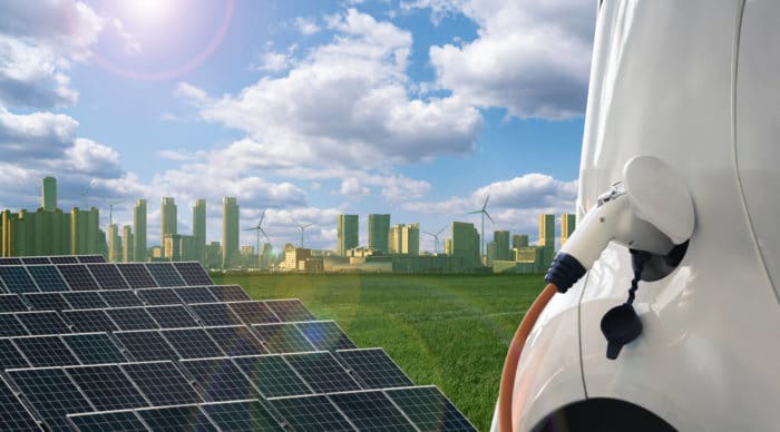 Picture of solar panels, el car and big city
